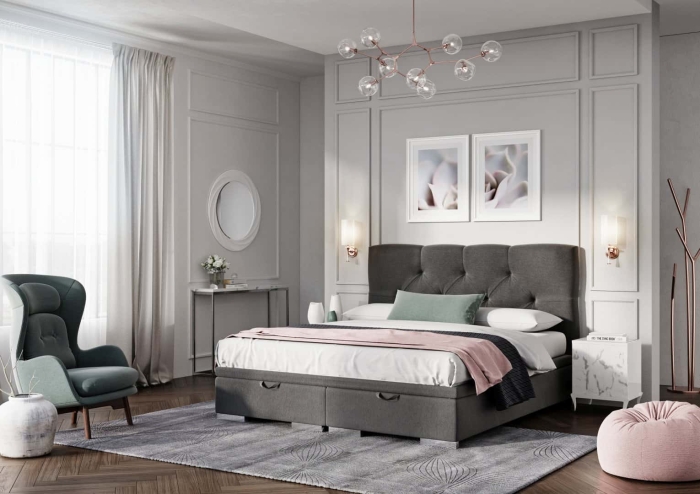 Łóżko Lazio Maxi tapicerowane z pojemnikami na pościel, pikowanym wezgłowiem i elegancką aranżacją wnętrza w jasnych barwach z różowymi akcentami.